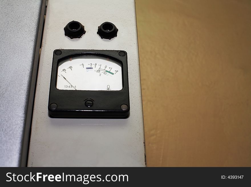 The old measuring tool on a background of a wall