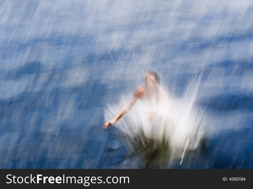 A Boy Jumping Into Water (abstract Photo).