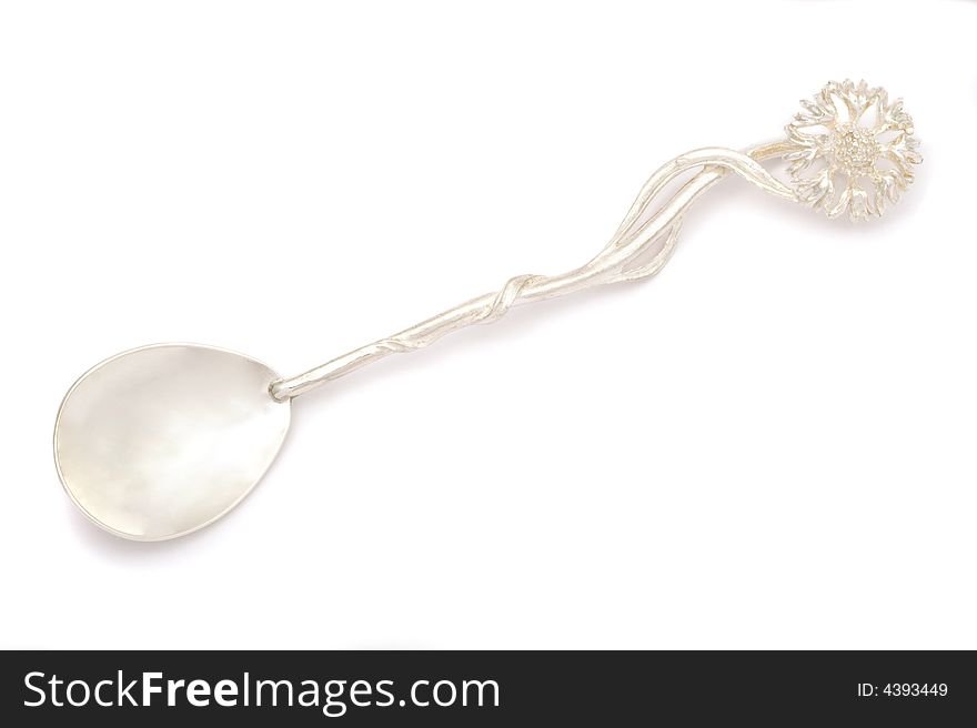 Vintage silver spoon with flower-shape handle.