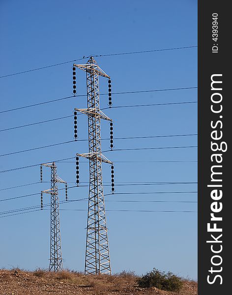 Electrical towers and wires in desert. Electrical towers and wires in desert