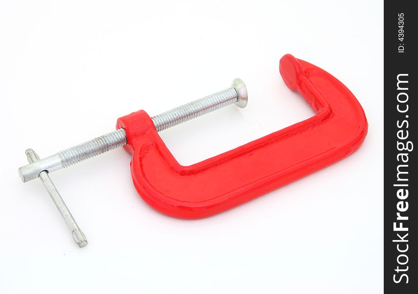 A red c clamp on white. A red c clamp on white