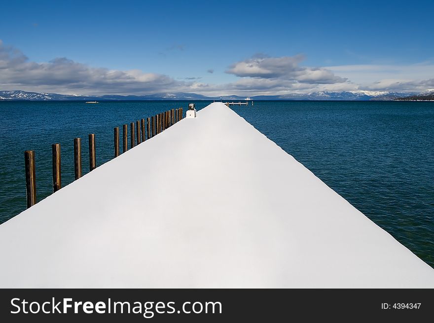 Public pier on the lake in winter