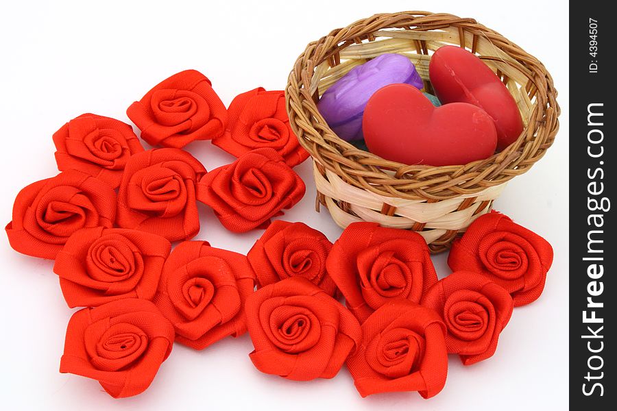 Basket with soaps in form of heart surrounded by ribbons. Basket with soaps in form of heart surrounded by ribbons