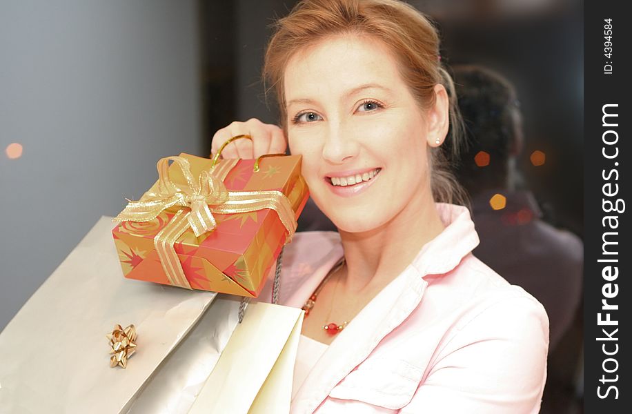 Smiling girl with a bags in the hands. Smiling girl with a bags in the hands