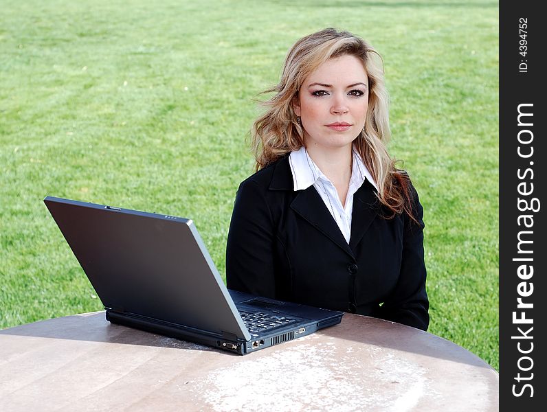 Portrait of a confident and successful businesswoman with a laptop. Portrait of a confident and successful businesswoman with a laptop
