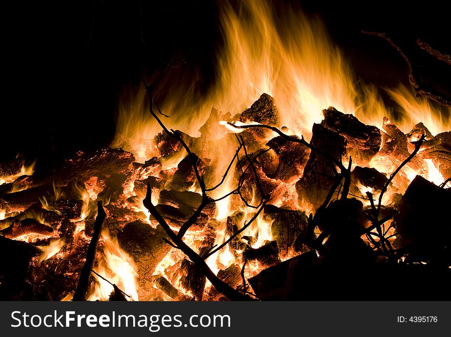 A big winter bonfire warms a chilly night. A big winter bonfire warms a chilly night.