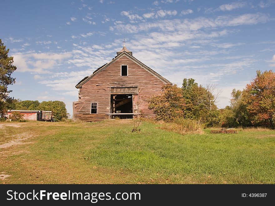 Wide shot of barn on green field. Wide shot of barn on green field