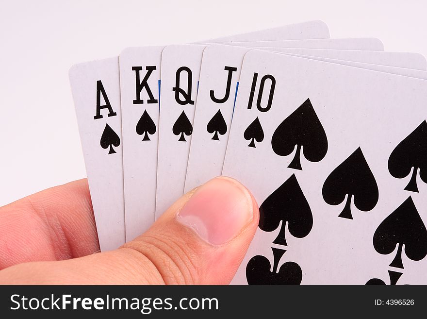 Poker player holding royal flush in hands. Poker player holding royal flush in hands