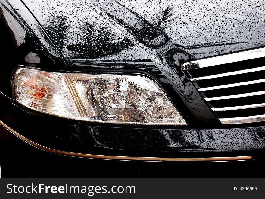 Car headlight in the rain