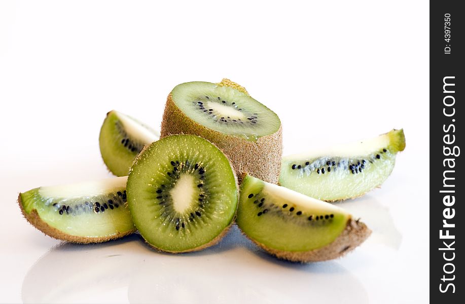 Kiwi fruit spliced and whole on white background isolated. Kiwi fruit spliced and whole on white background isolated