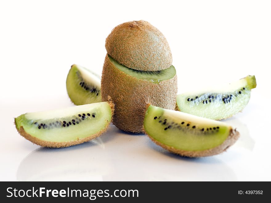 Colorful Kiwi Fruit Whole And Cut By Four Pieces