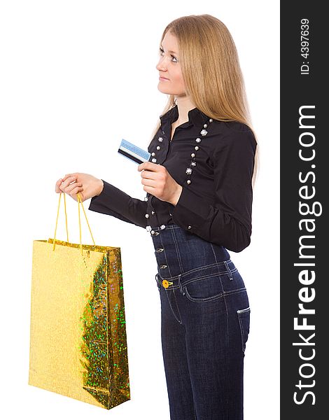 Happy young girl with credit card and shopping bag isolate on white