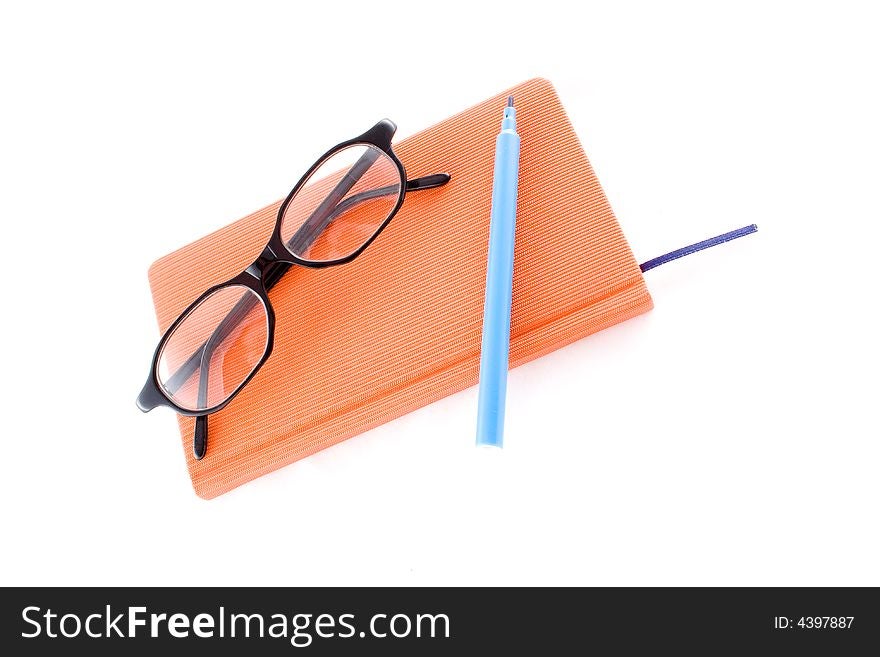 Red calendar and black glasses isolated on a white background