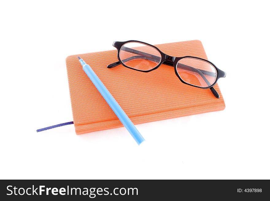 Red calendar and black glasses isolated on a white background