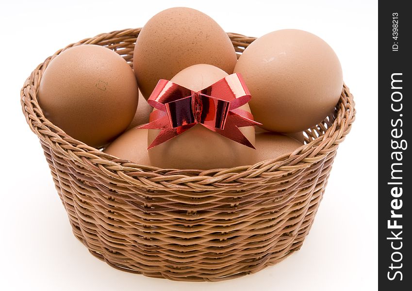 Easter Eggs in Basket on White Background