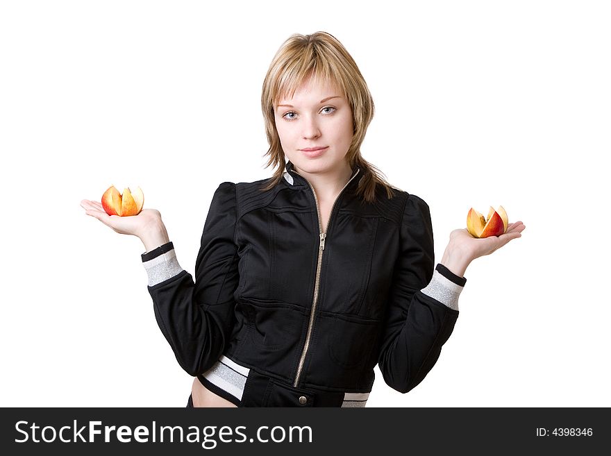 A girl hands parts of the apple in her hands. A girl hands parts of the apple in her hands