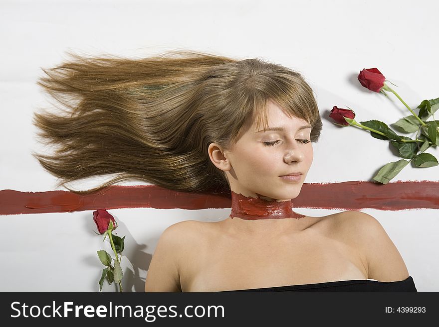 A beautiful young woman with painted neck, closed eyes and roses