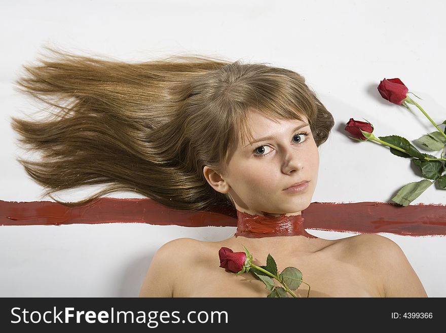 A beautiful young woman with painted neck and roses
