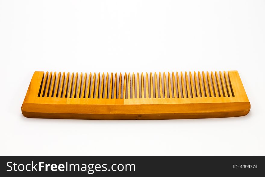 Wooden hairbrush on white background