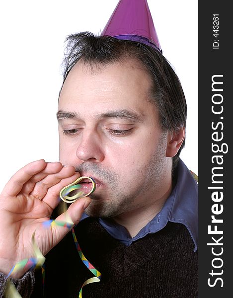 Man is blowing a paper streamer