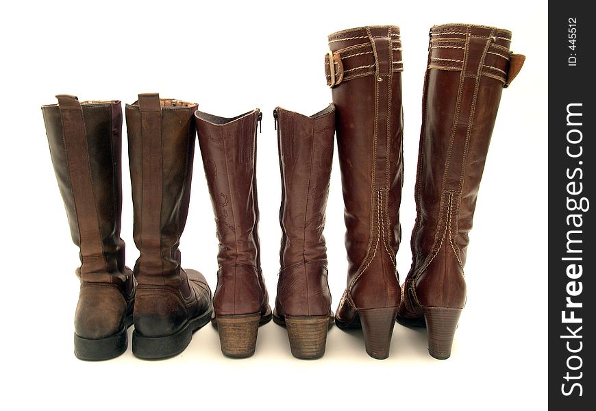 Three par of brown leather boots isolated on white background. Three par of brown leather boots isolated on white background