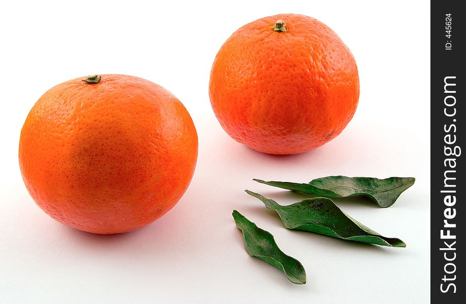 Two tangerines and three leaves