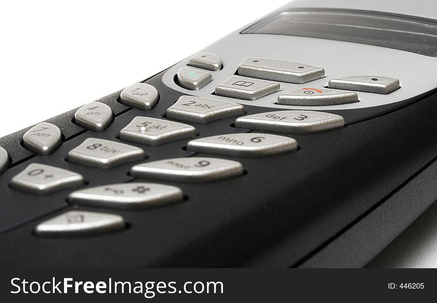 Detail of a cordless telephone on a white background. Detail of a cordless telephone on a white background.