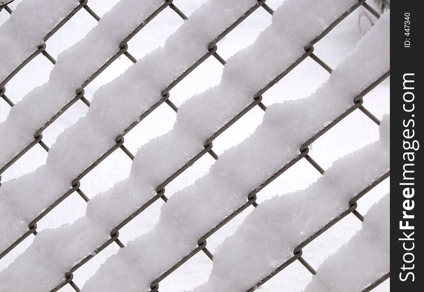 Wired fence covered with snow