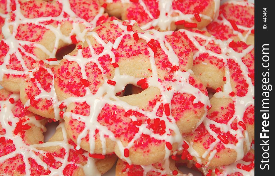 Butter cookies with pink sprinkles & frosting. Butter cookies with pink sprinkles & frosting.