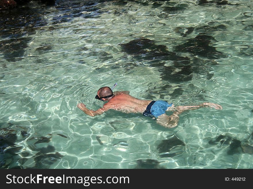 A man snorkelling in the ocean