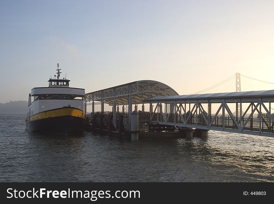 A commuter ferry pulls up to it's dock in San Francisco. A commuter ferry pulls up to it's dock in San Francisco.