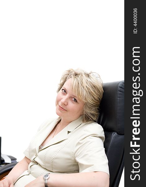 Mid-life business woman in chair at office. Top part of image isolated on white for copyspace