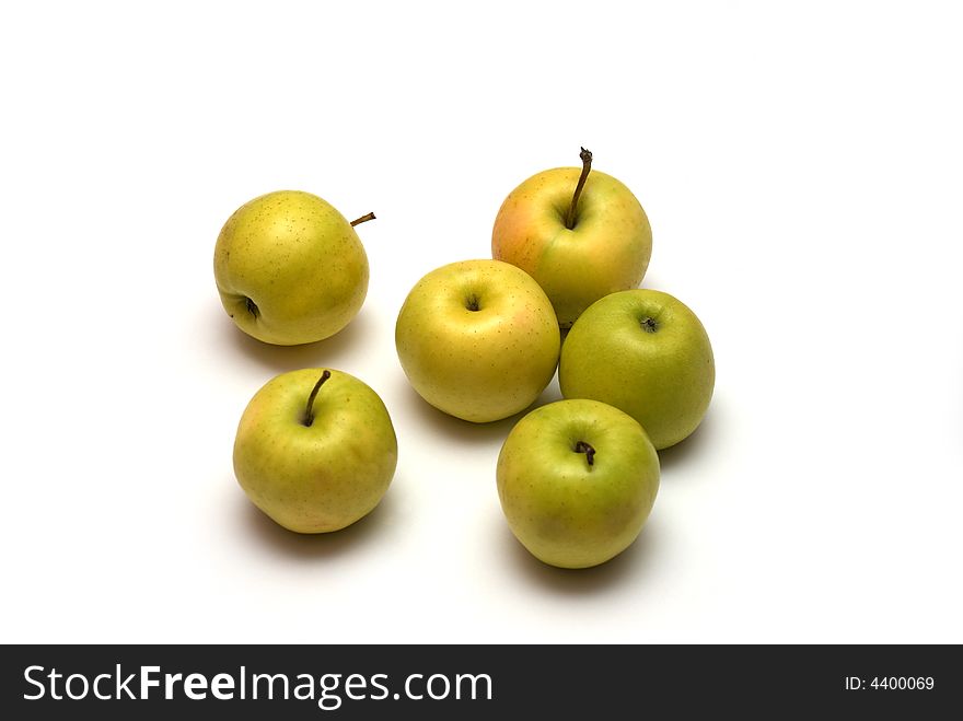 Juicy green apples on the white background