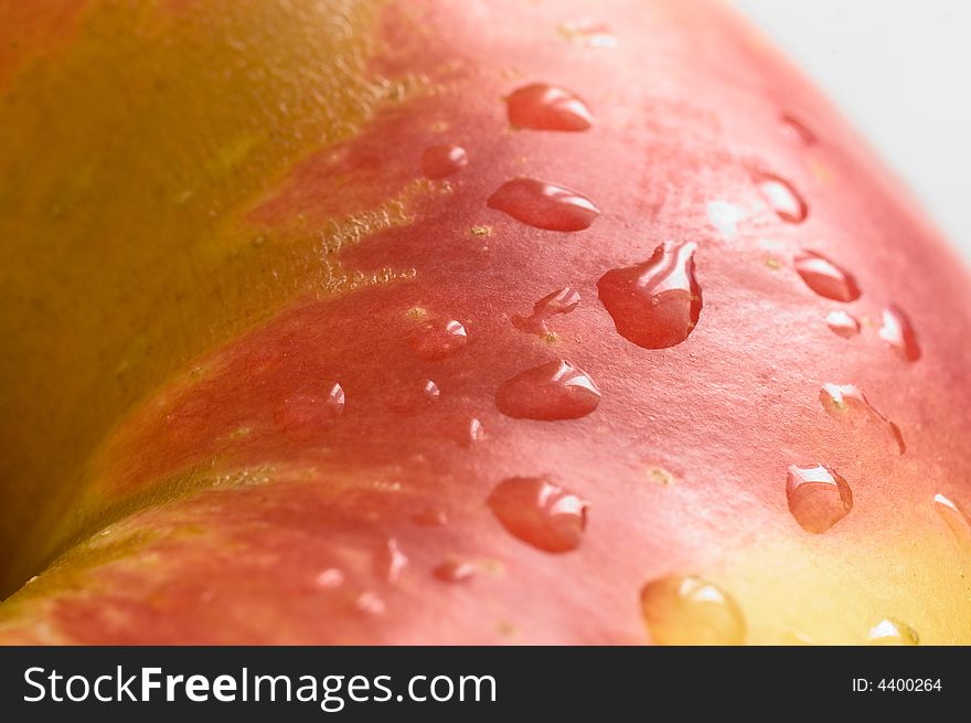 Part of a fresh wet apple on white background