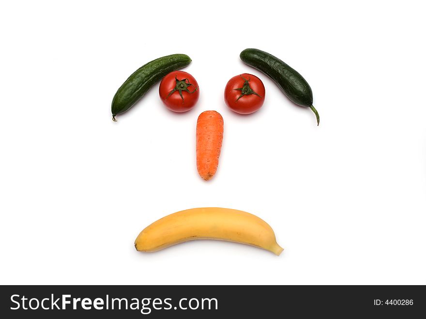 Face made with vegetables on the white background. Face made with vegetables on the white background