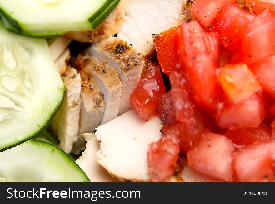 Fresh chicken salad with cucumber and chopped tomatoes. Fresh chicken salad with cucumber and chopped tomatoes