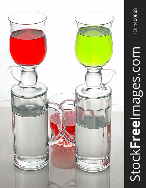 Composition from glasses with multi-coloured drinks