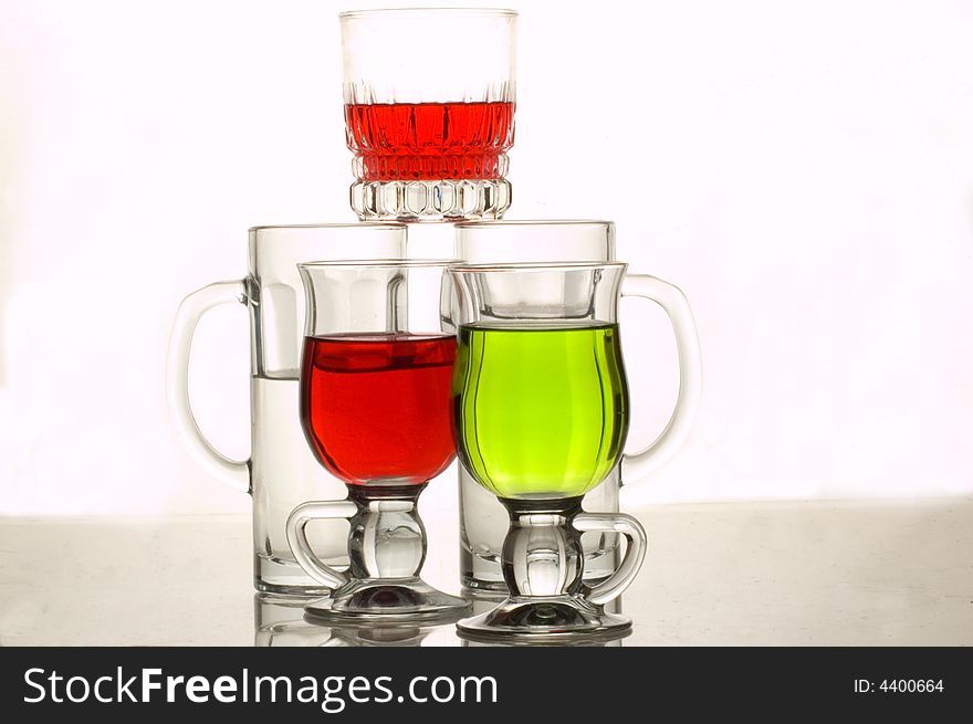 Composition from glasses with multi-coloured drinks