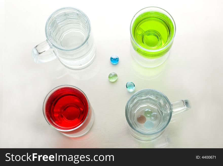 Composition from glasses with multi-coloured drinks