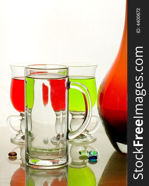 Composition from glasses with multi-coloured drinks