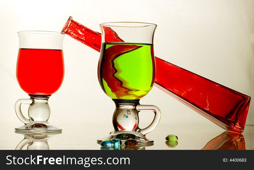 Composition from glasses with multi-coloured drinks