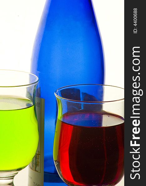 Composition from glasses with multi-coloured drinks