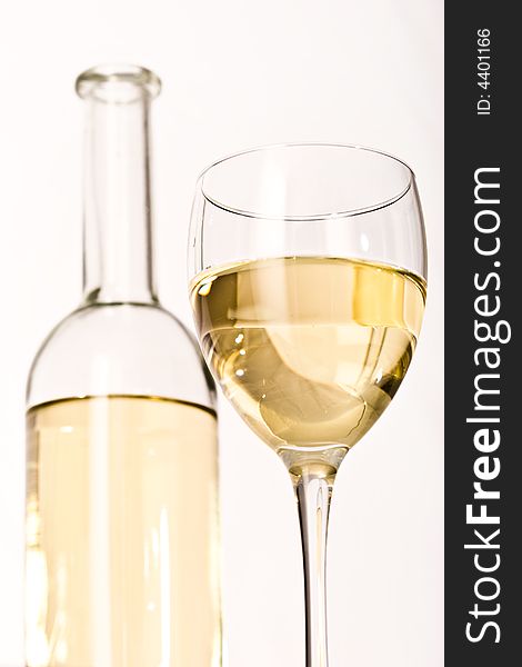 Drink series: white wine glass and bottle over white
