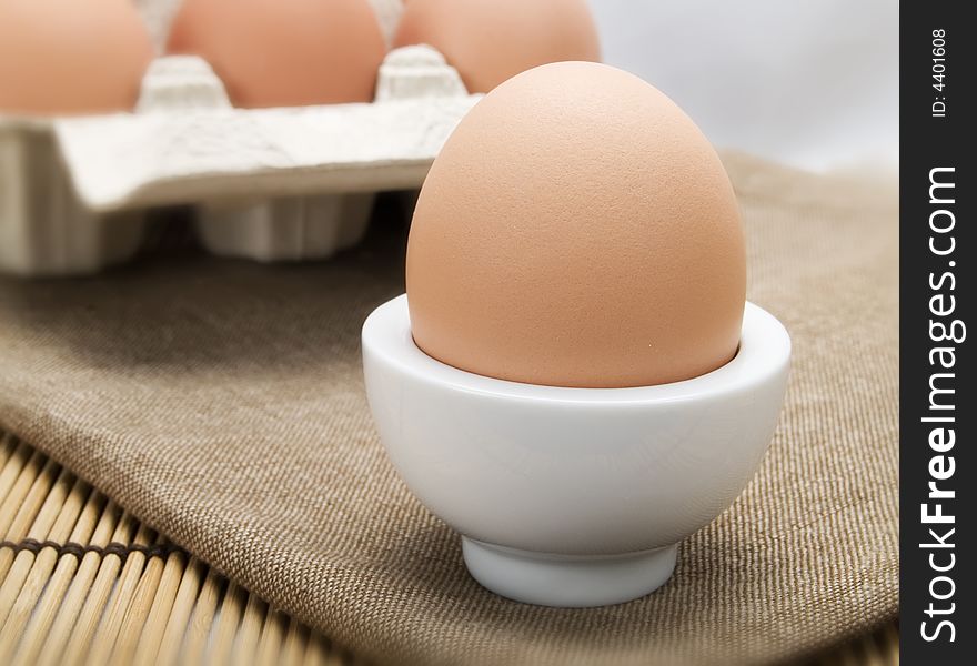 Close-up of an egg in a white eggcup