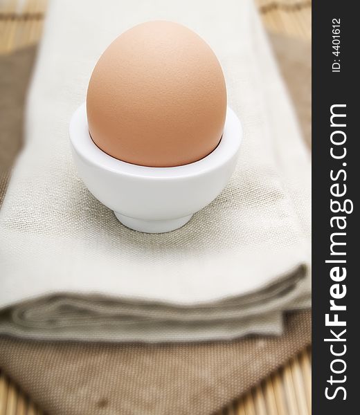 Close-up of an egg in a white eggcup