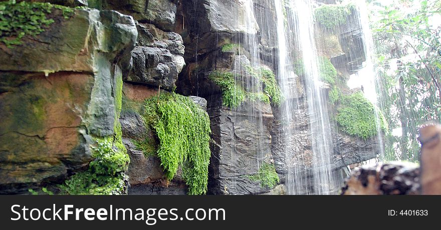 Waterfall cascading over wet rocks