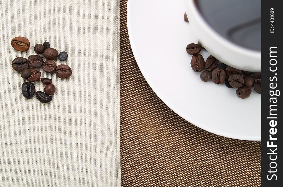 Coffee beans and a coffee cup. Coffee beans and a coffee cup