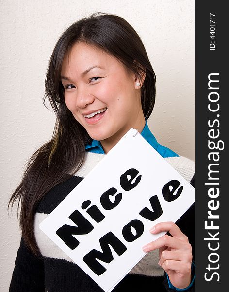 Asian female holding a nice move sign. Asian female holding a nice move sign.