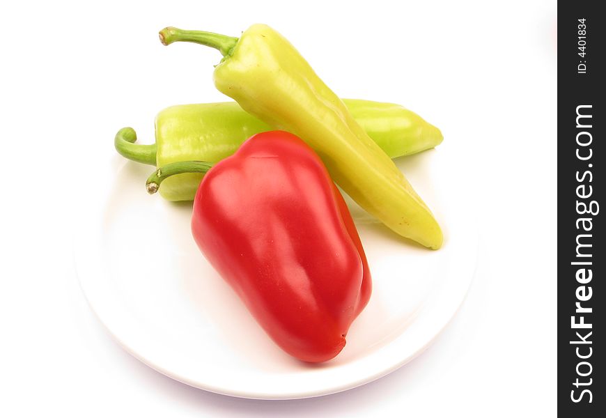 Three peppers fresh on the plate. Three peppers fresh on the plate