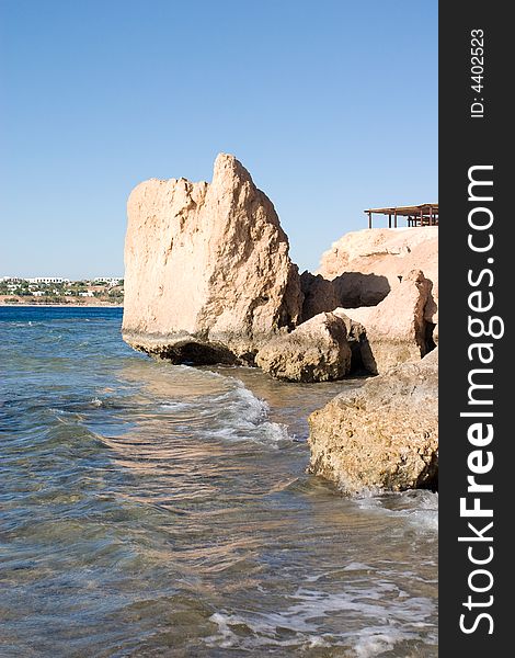 Rocks of Red sea and a view to the line of hotels. Rocks of Red sea and a view to the line of hotels